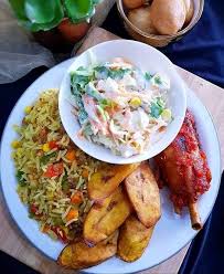 Fried Rice, salad, plantain, and Turkey